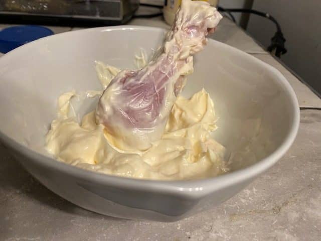 Chicken in bowl of mayonnaise