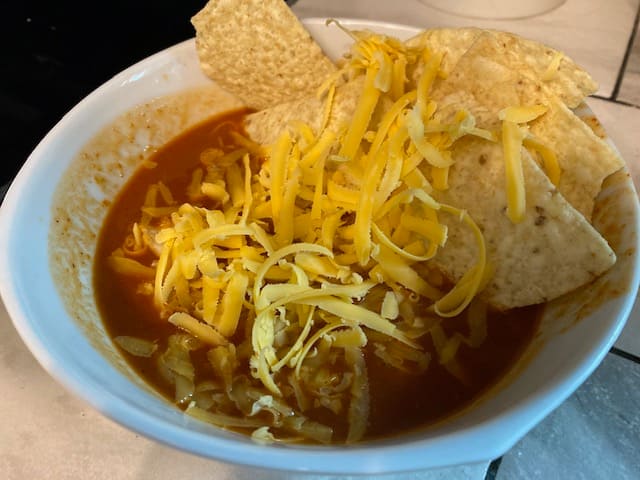 Chris's Mexichili Soup, with cheese and chips.