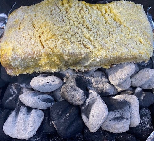 Charcoal grill brisket on coals 